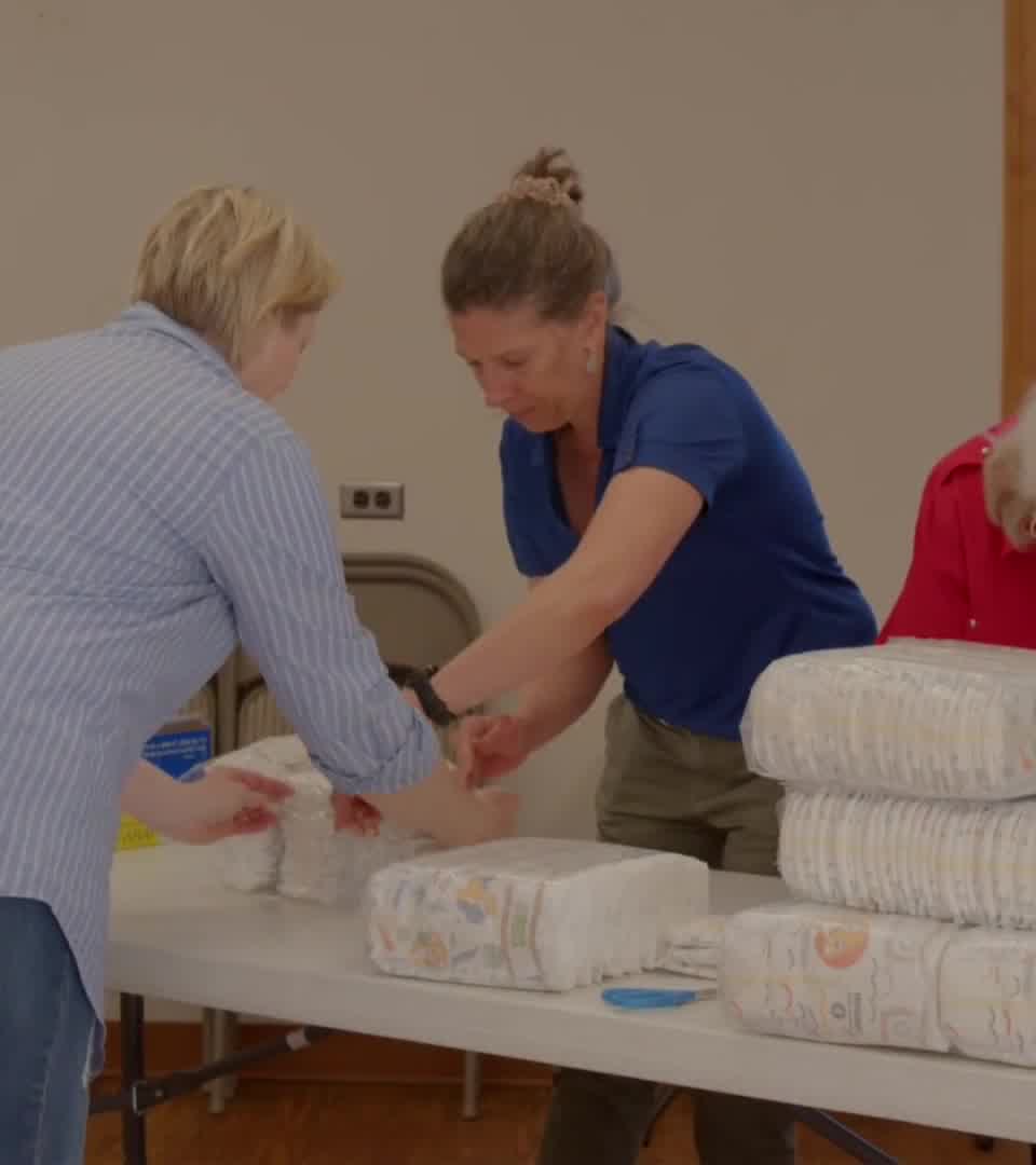An Idaho Diaper Bank volunteer preparing supplies